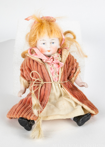 "Lucy" Porcelain Doll with Pink Coat